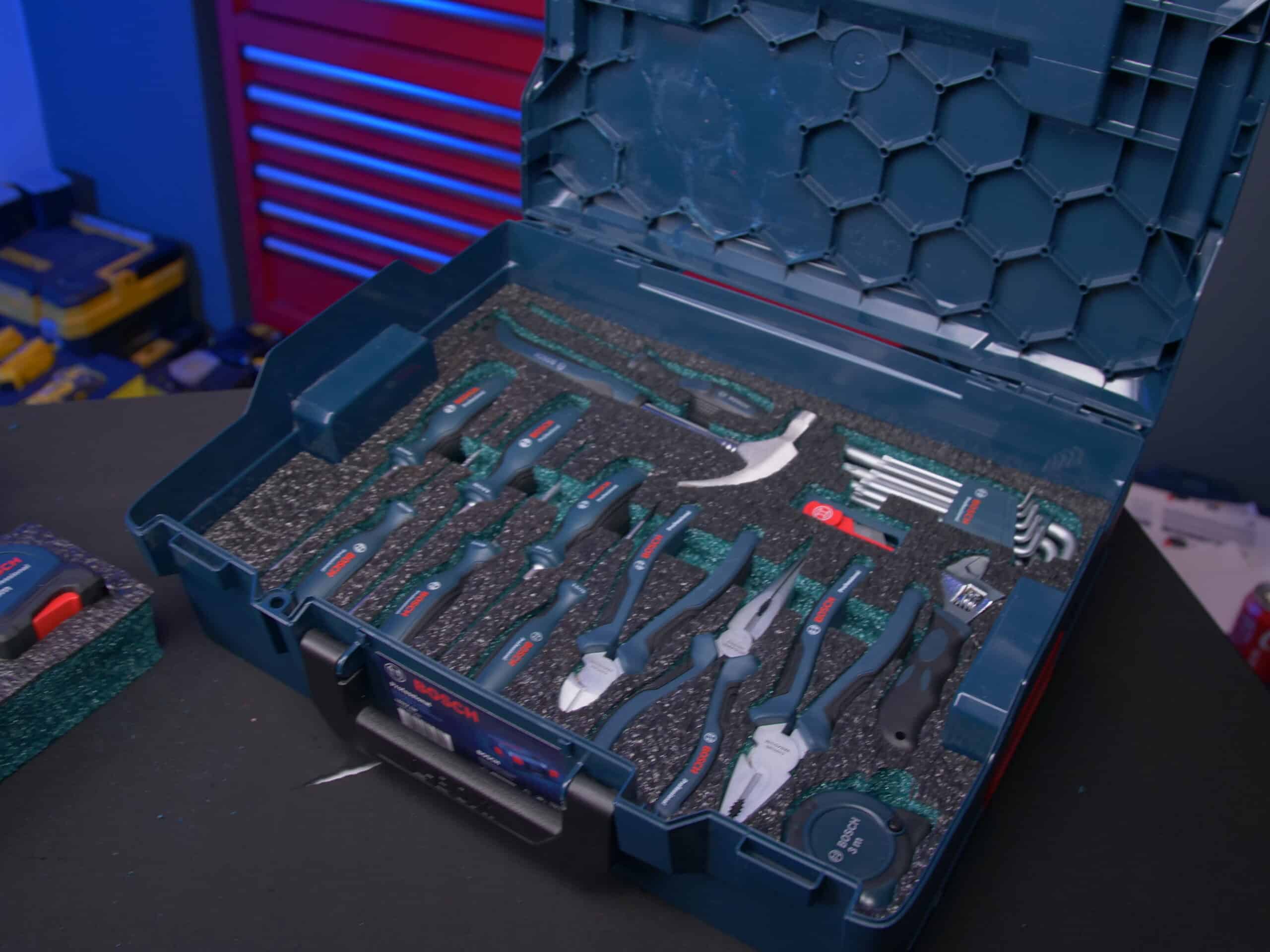 A Bosch L-Boxx foam insert is set neatly inside the Bosch Tool Box.  It is black on the face with teal beneath which is visible in the cut sections